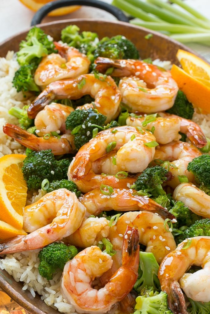 This orange shrimp and broccoli with garlic sesame fried rice is the perfect quick and easy meal for a busy weeknight or for entertaining guests. #HolidayRiceRecipes Ad