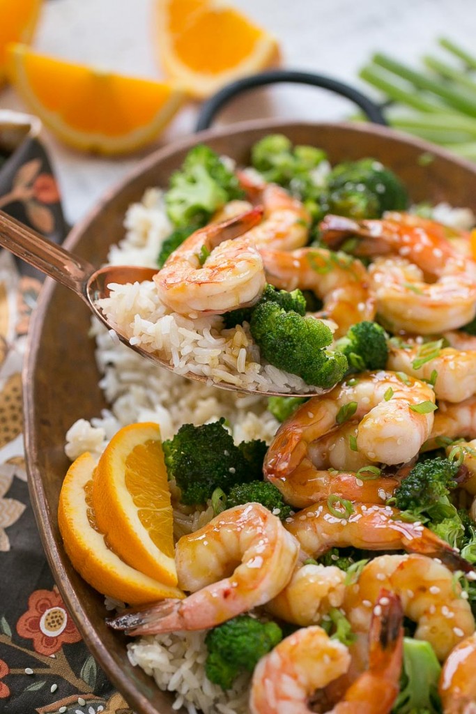 This orange shrimp and broccoli with garlic sesame fried rice is the perfect quick and easy meal for a busy weeknight or for entertaining guests. #HolidayRiceRecipes Ad