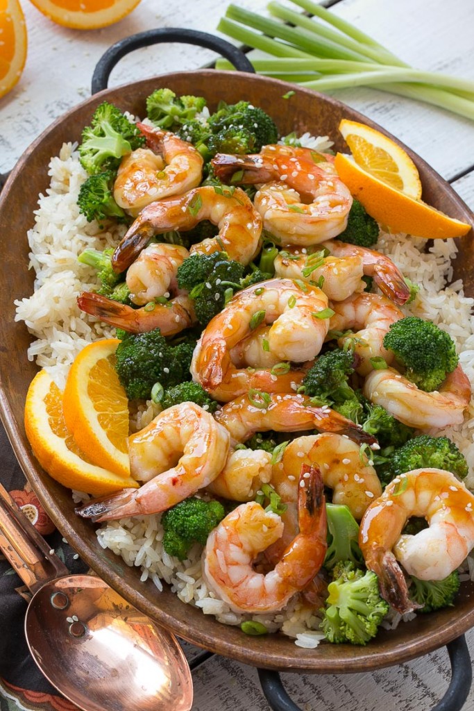 This orange shrimp and broccoli with garlic sesame fried rice is the perfect quick and easy meal for a busy weeknight or for entertaining guests. #HolidayRiceRecipes Ad